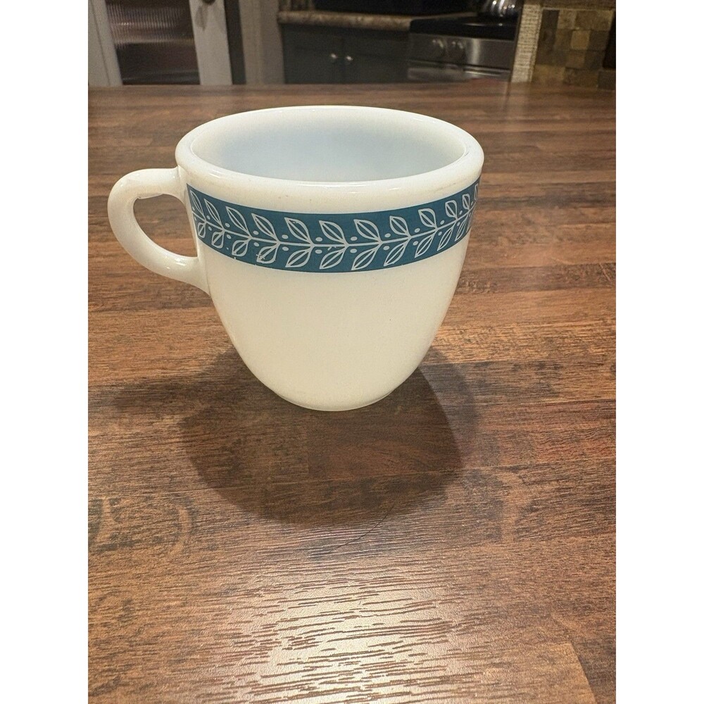 vintage Pyrex coffee cup in the turquoise "Bluegrass" or "Laurel Leaf" pattern